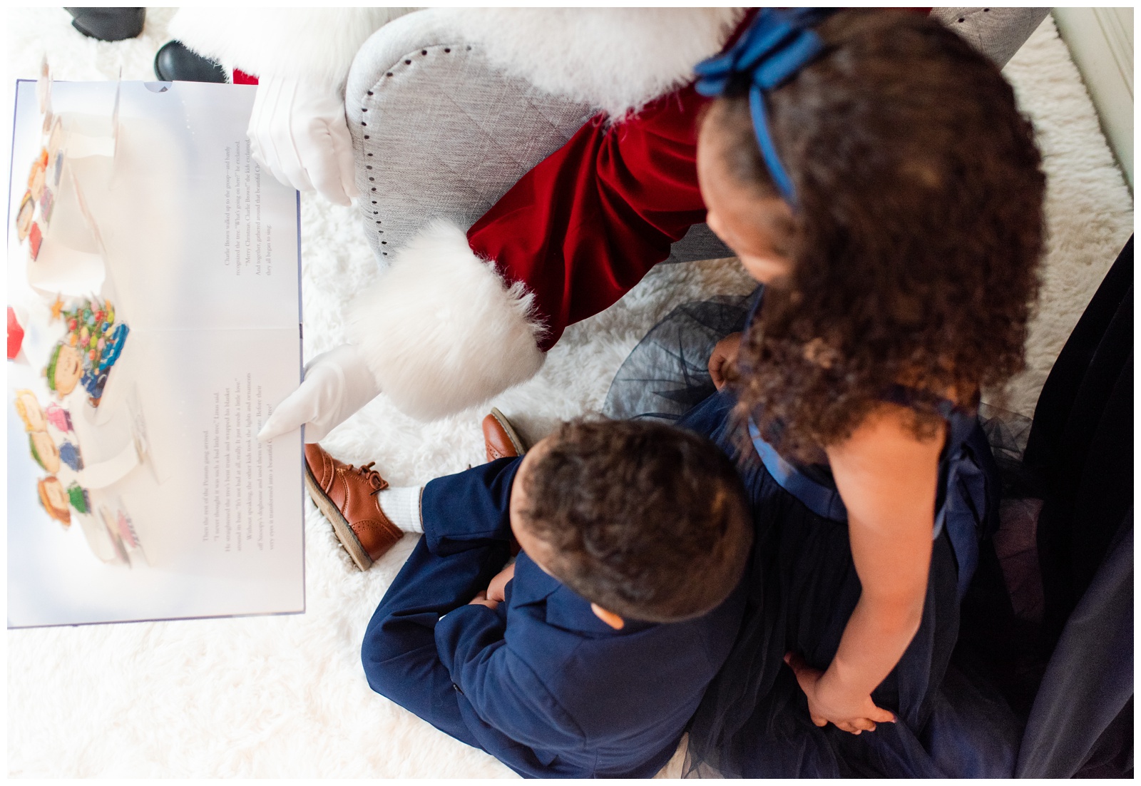 Kids reading a book with Santa